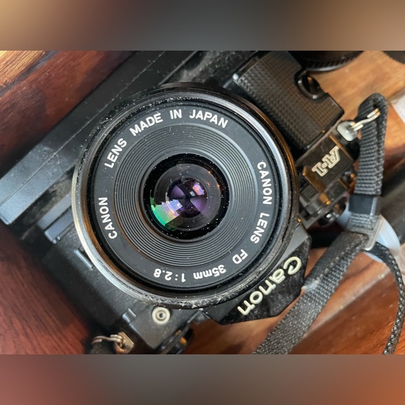 Canon a1 with motor drive and three lenses. - Picture 2 of 4